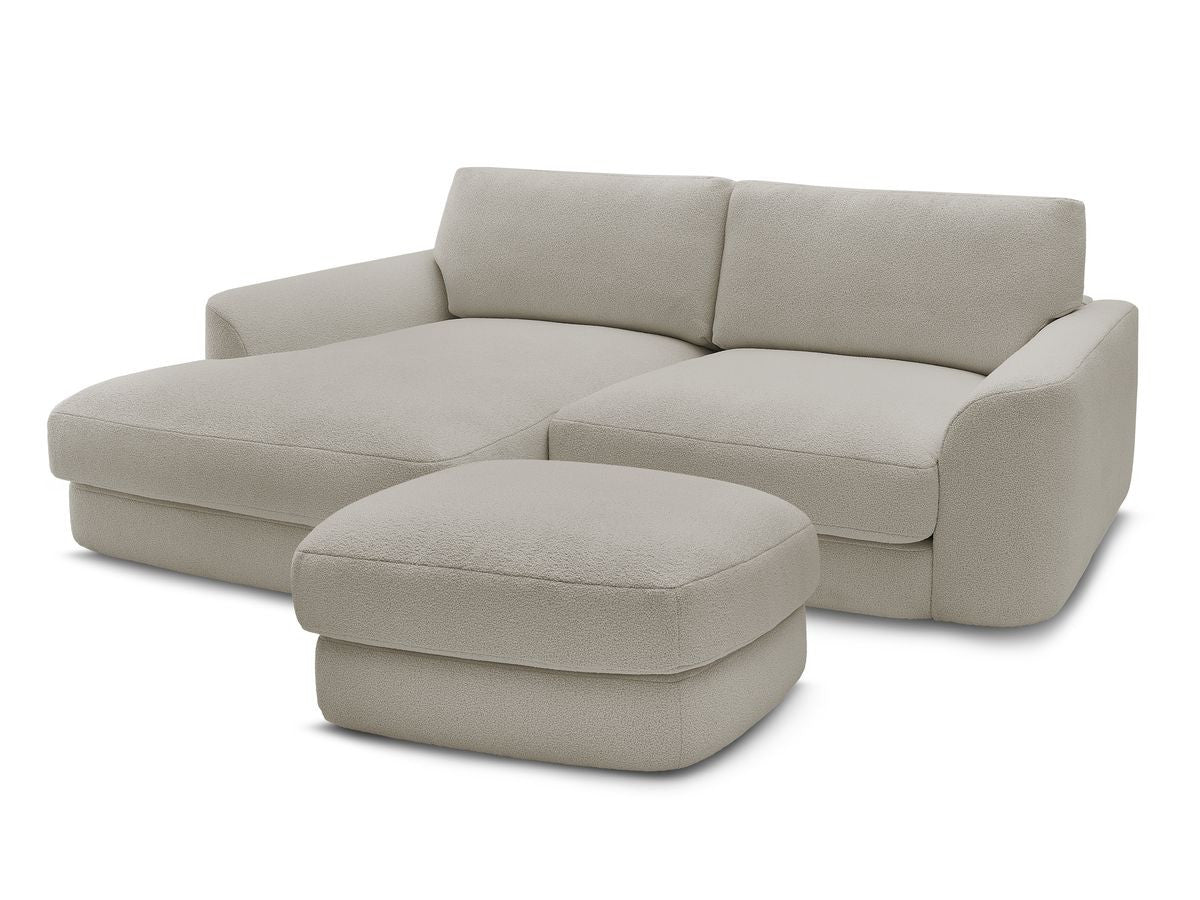 Hjørnesofa LEONORE i bouclé-stoff med puff