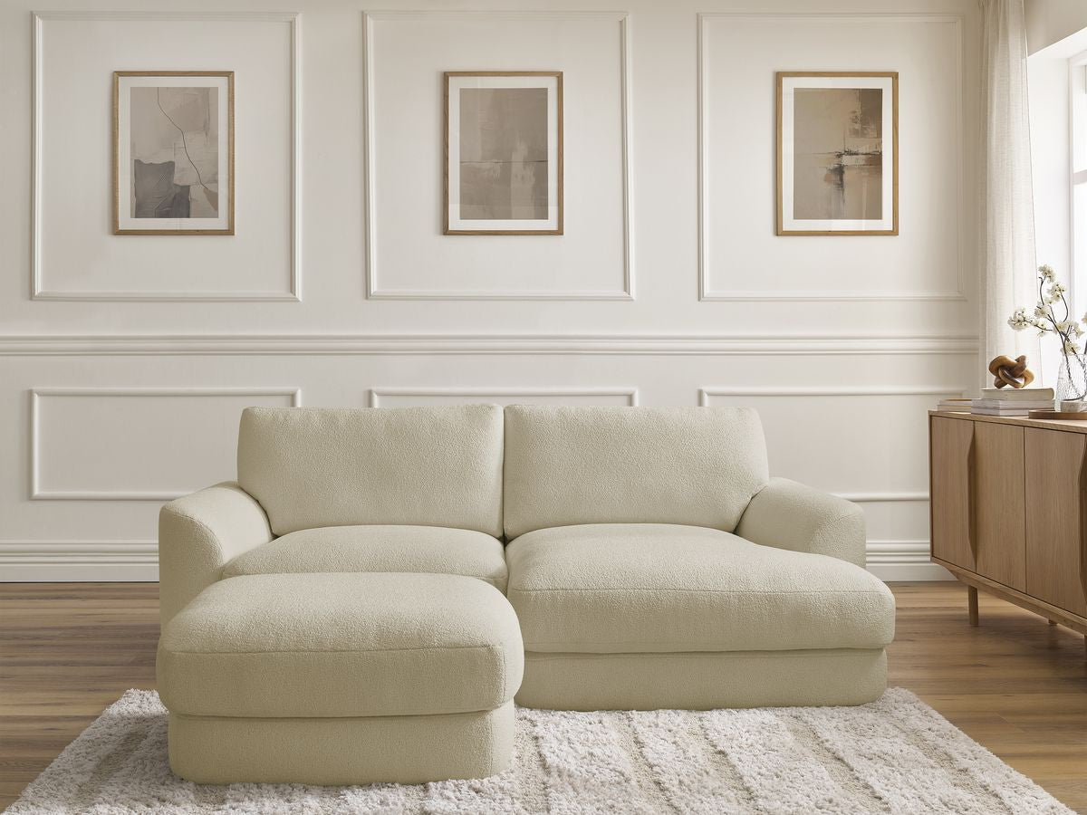 Hjørnesofa LEONORE i bouclé-stoff med puff