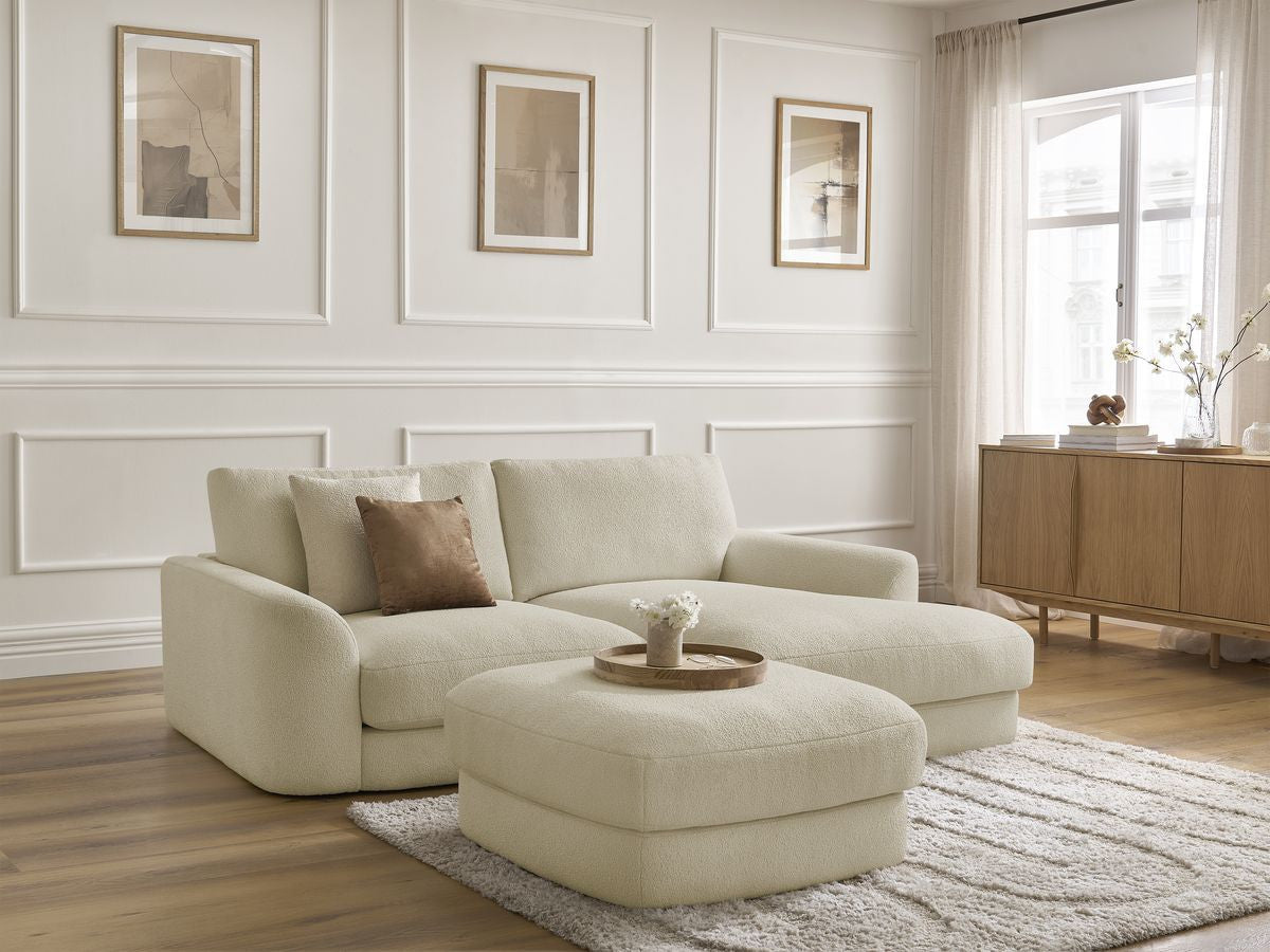 Hjørnesofa LEONORE i bouclé-stoff med puff