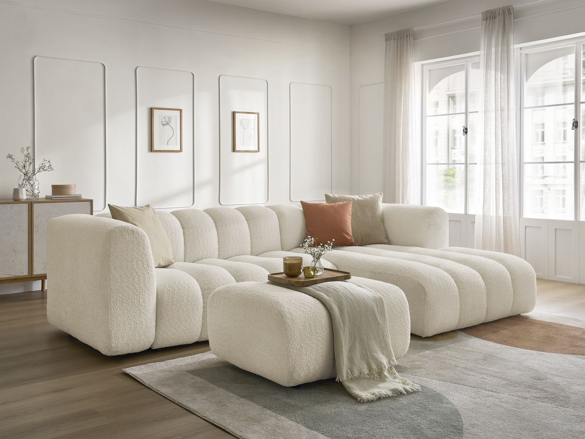 Hjørnesofa TALIA i bouclé-stoff med puff