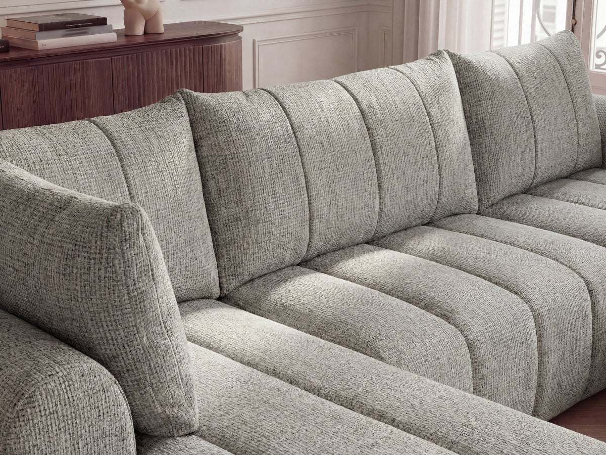 U-sofa NESTY i melert stoff med puff